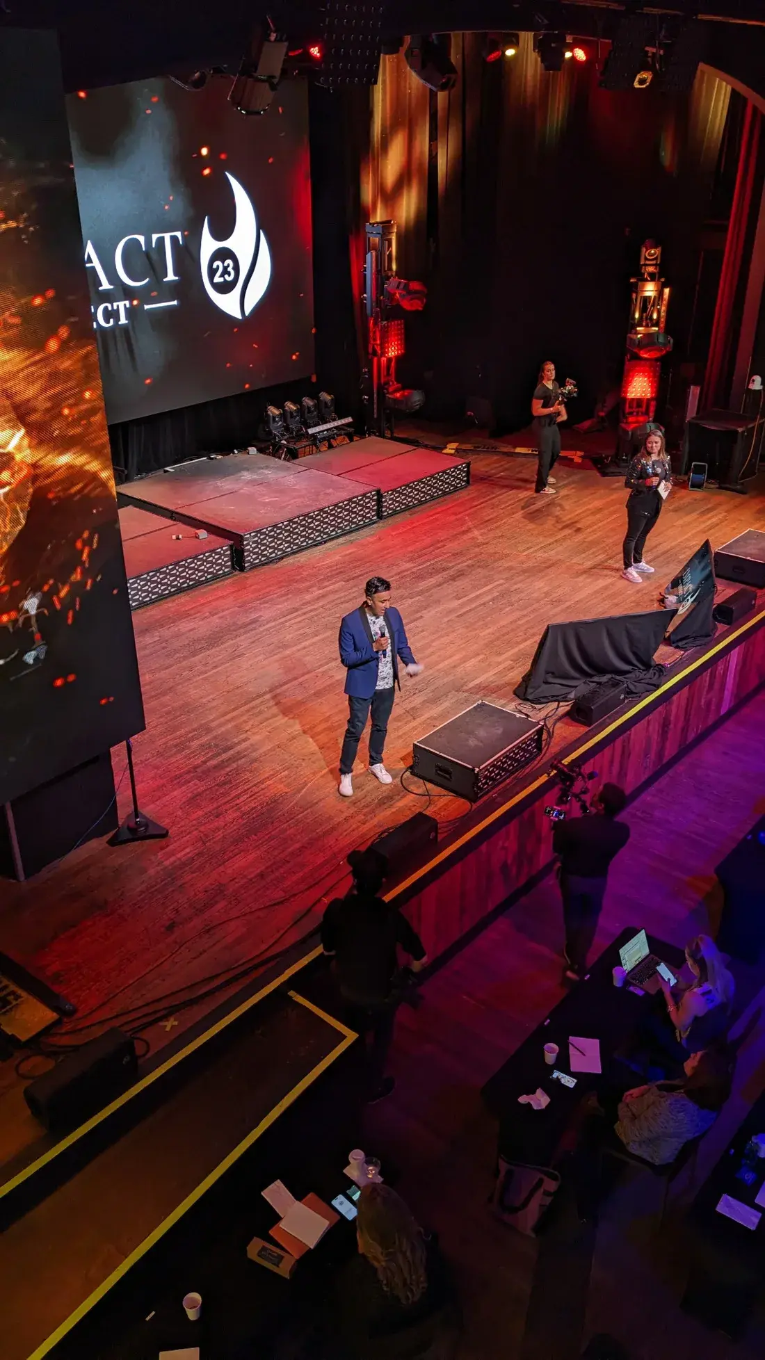 An overhead view of Neo speaking on stage
